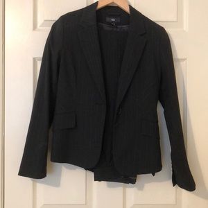 Black suit with white pin stripes